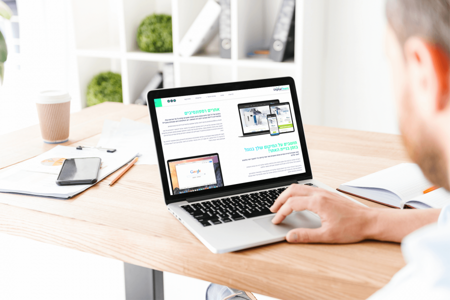 macbook-mockup-of-a-man-working-on-his-desk-36934-r-el2